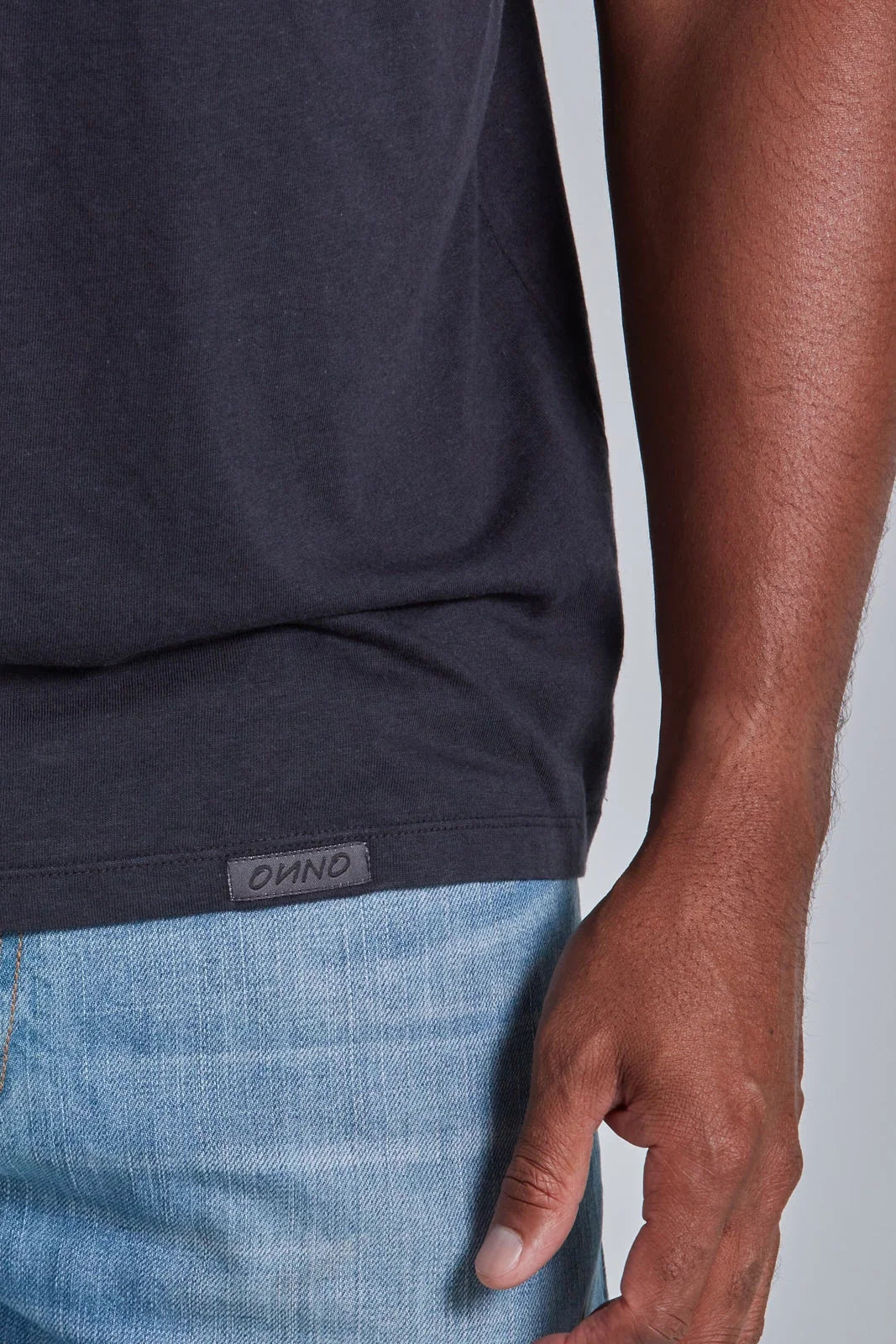 ONNO bamboo t-shirt in Charcoal Blue, Golden is 6'0" and wearing size L.