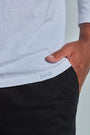 ONNO long sleeve bamboo t-shirt in White, Golden is 6'0" and wearing size L.