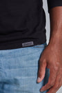 ONNO long sleeve bamboo t-shirt in Black, Golden is 6'0" and wearing size L.