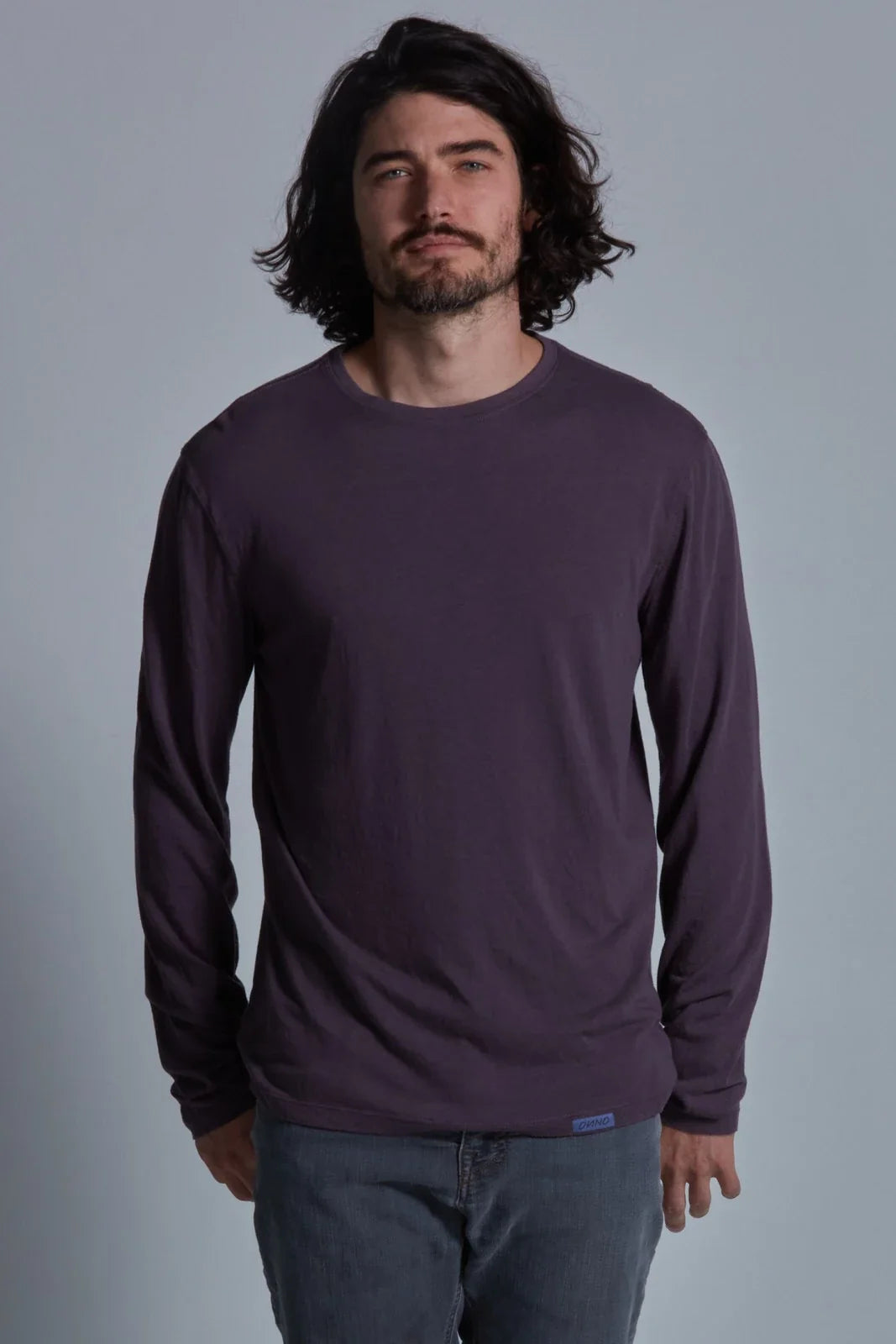 ONNO long sleeve bamboo t-shirt in Dirty Purple, Nic is 5'11" and wearing size M.