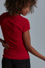 ONNO bamboo t-shirt in Earth Red Unpatched, Sage is 5'7" and wearing size XS.