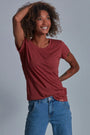 ONNO bamboo t-shirt in Brick, Sage is 5'7" and wearing size XS.