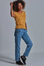 ONNO bamboo t-shirt in Mustard, Sage is 5'7" and wearing size XS.