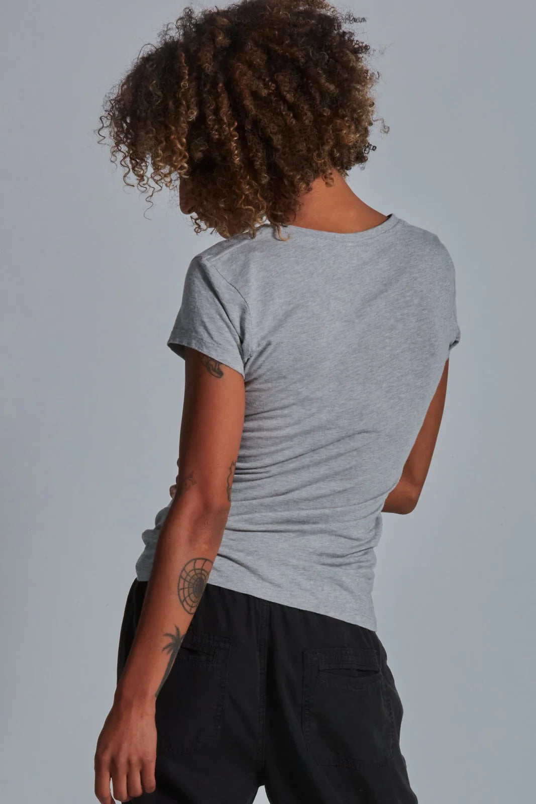 ONNO bamboo t-shirt in Heathered Granite, Sage is 5'7" and wearing size XS.