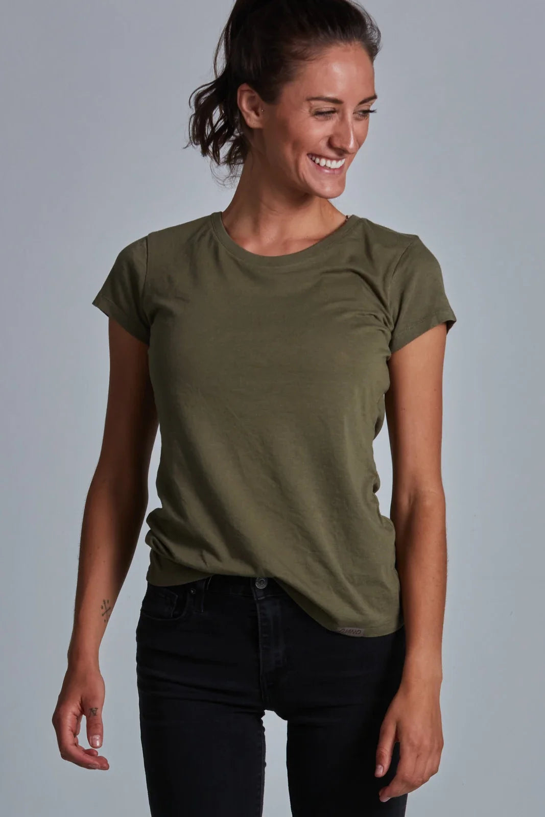 ONNO bamboo t-shirt in Charcoal Blue, Sage is 5'7" and wearing size XS.