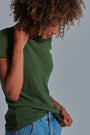 ONNO bamboo t-shirt in Moss Green, Sage is 5'7" and wearing size XS.