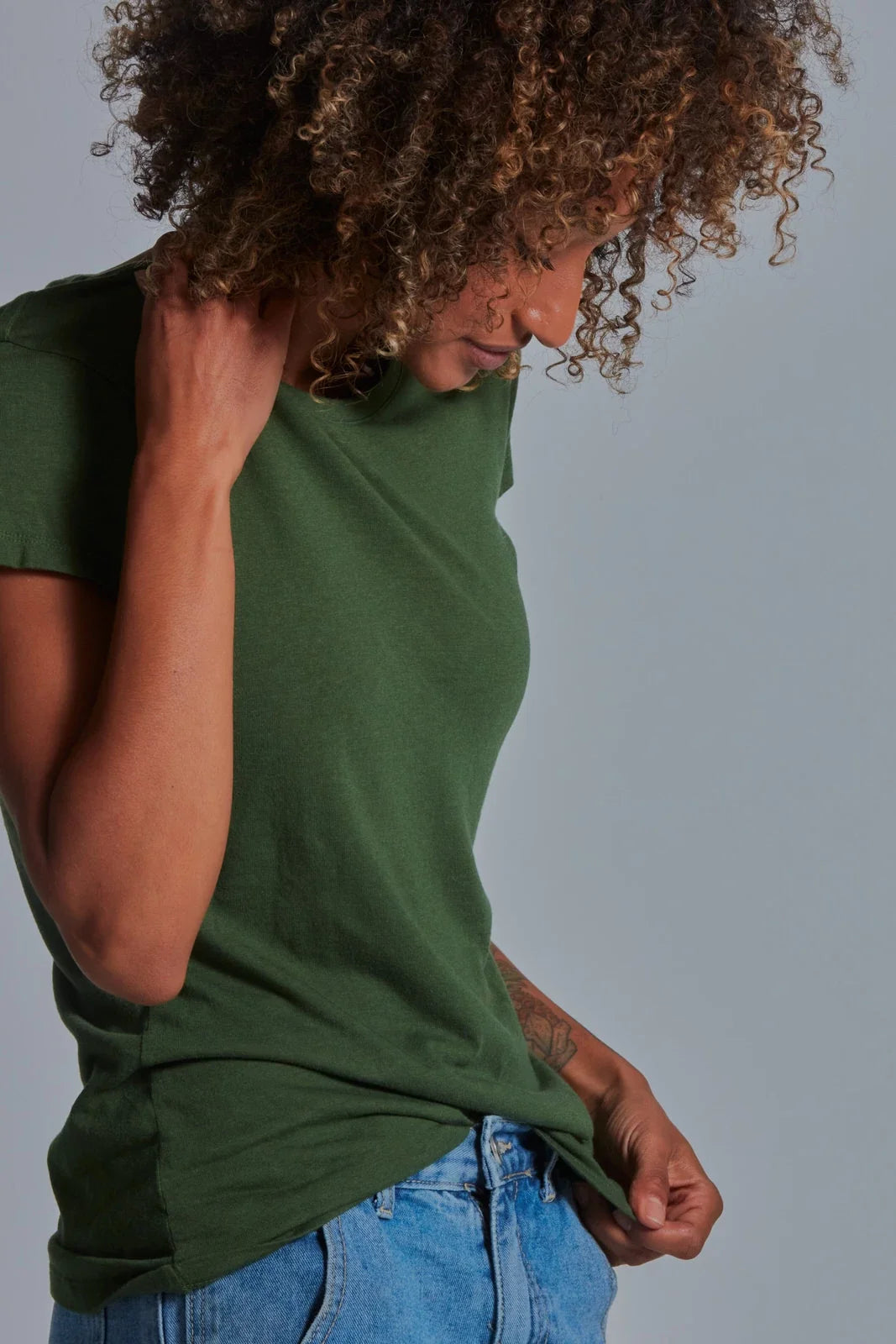 ONNO bamboo t-shirt in Moss Green, Sage is 5'7" and wearing size XS.
