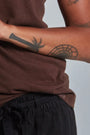 ONNO bamboo t-shirt in Espresso, Sage is 5'7" and wearing size XS.