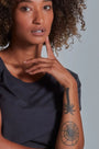 ONNO bamboo t-shirt in Charcoal Blue, Sage is 5'7" and wearing size XS.