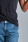 ONNO bamboo t-shirt in Charcoal Blue, Sage is 5'7" and wearing size XS.