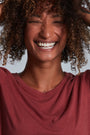 ONNO long sleeve bamboo t-shirt in Brick, Sage is 5'7" and wearing size XS.