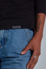 ONNO long sleeve bamboo t-shirt in Black, Sage is 5'7" and wearing size XS.