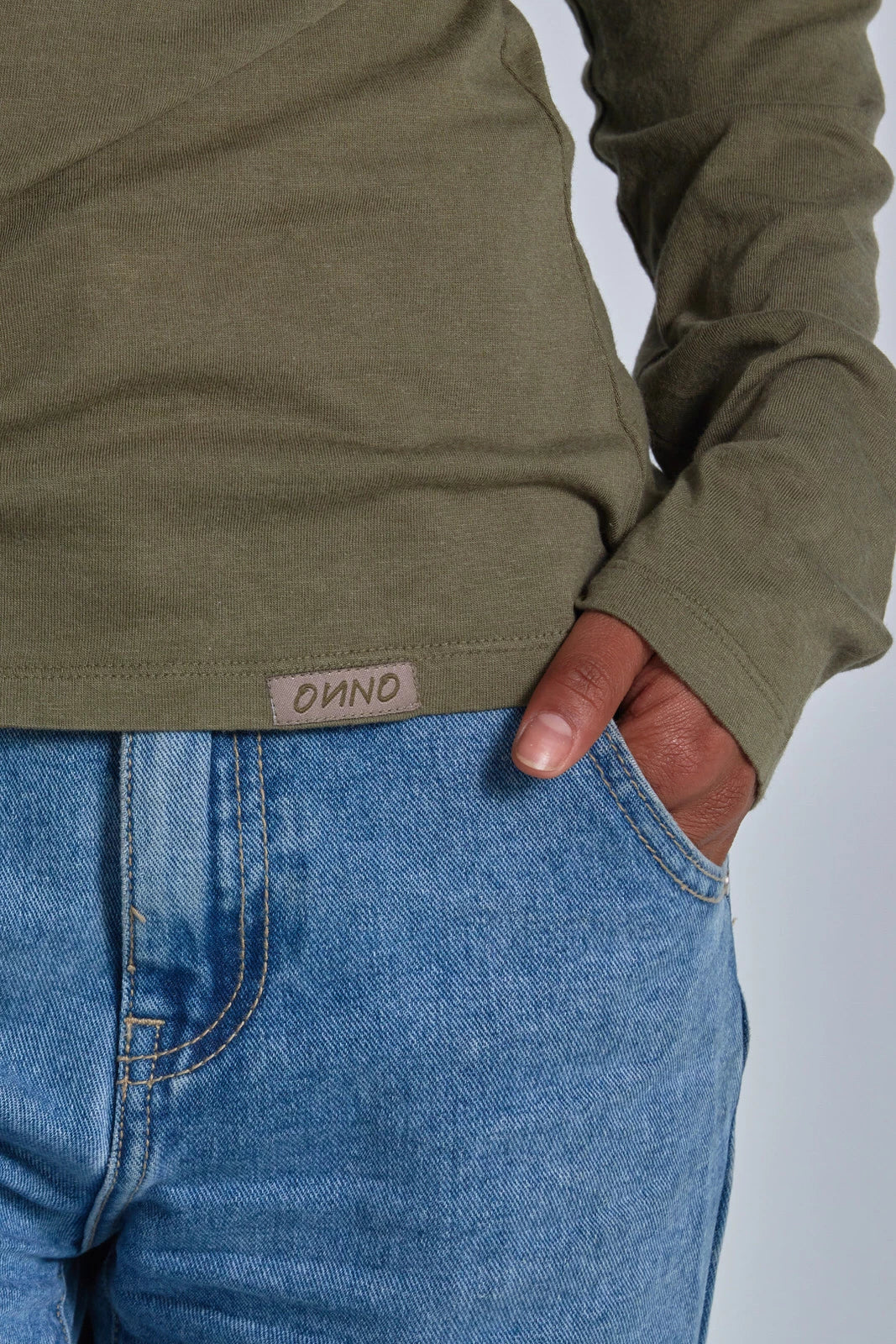 ONNO long sleeve bamboo t-shirt in Cypress, Sage is 5'7" and wearing size XS.