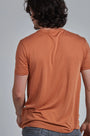ONNO lyocell bamboo t-shirt in Rust, Nic is 5'11" and wearing size M.