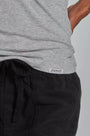 ONNO beechwood t-shirt in Heathered Granite, Sage is 5'7" and wearing size XS.