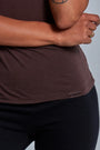 ONNO beechwood t-shirt in Espresso, Sage is 5'7" and wearing size XS.