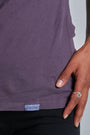 ONNO organic cotton t-shirt in Dirty Purple, Sage is 5'7" and wearing size XS.