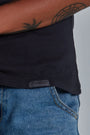 ONNO organic cotton t-shirt in Charcoal Blue, Sage is 5'7" and wearing size XS.